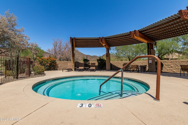 view of pool with a patio area, a swimming pool, fence, and a pergola