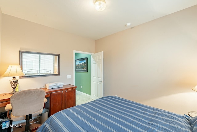 bedroom featuring baseboards and carpet flooring