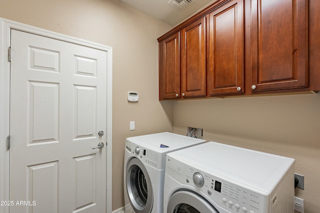 laundry room featuring cabinet space, independent washer and dryer, and visible vents