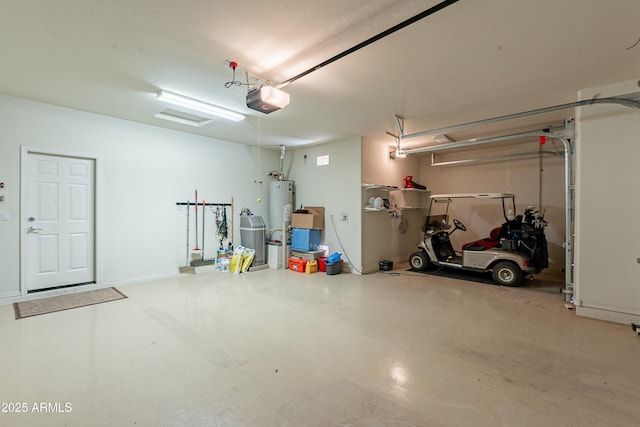 garage with a garage door opener and gas water heater