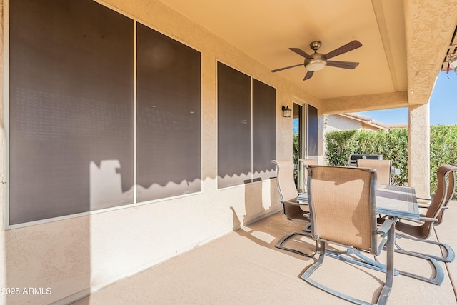 view of patio with a ceiling fan and outdoor dining space