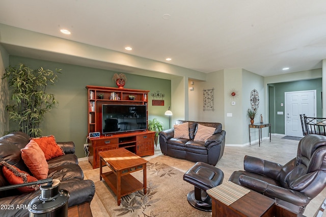 living area with baseboards and recessed lighting