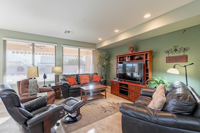 living area with recessed lighting, visible vents, and light tile patterned floors