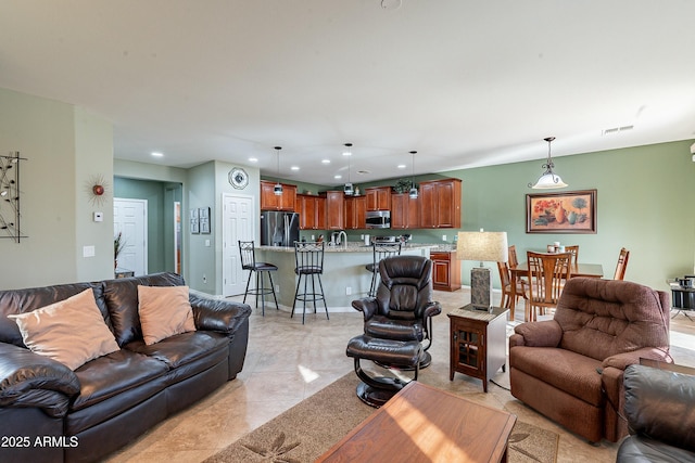 living area with baseboards, light tile patterned floors, visible vents, and recessed lighting