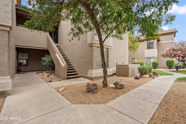 surrounding community featuring stairway