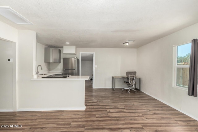 1424 S Bonarden Ln, Tempe, AZ 85281 - kitchen with freestanding refrigerator, dark wood-type flooring, gray cabinets, a sink, and light countertops