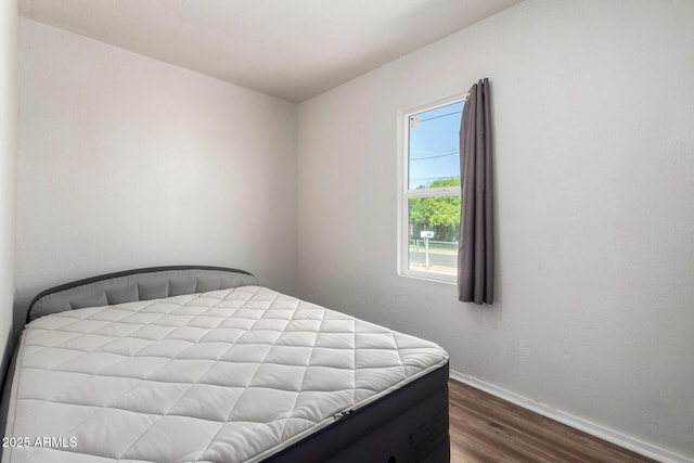 1424 S Bonarden Ln, Tempe, AZ 85281 - bedroom featuring baseboards and wood finished floors