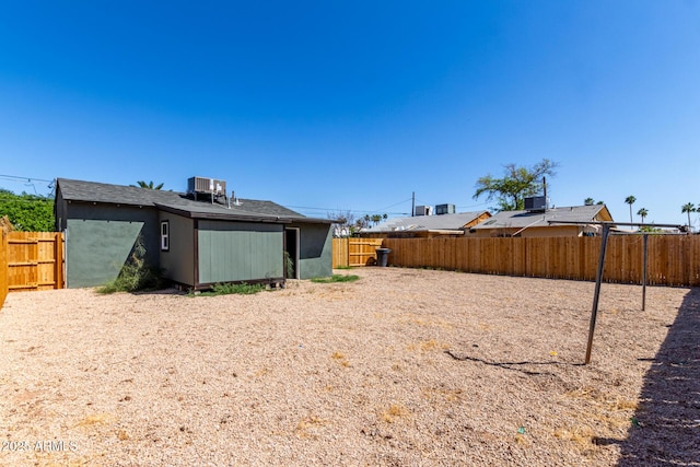 1424 S Bonarden Ln, Tempe, AZ 85281 - rear view of property featuring a fenced backyard and central AC