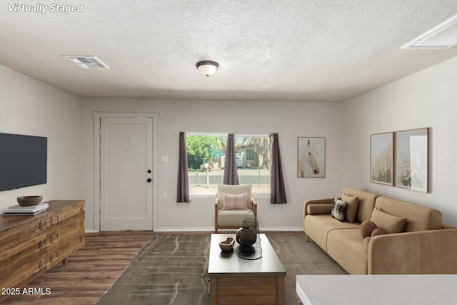 1424 S Bonarden Ln, Tempe, AZ 85281 - living room with a textured ceiling, wood finished floors, and visible vents