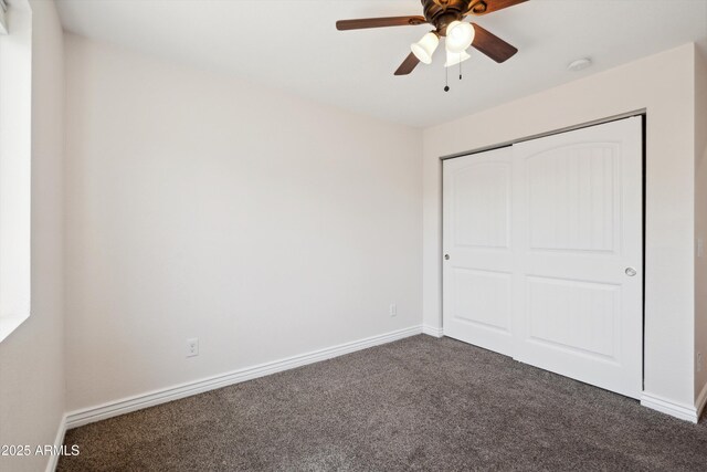 2726 E Fairmount Ave, Phoenix, AZ 85016 - unfurnished bedroom with a ceiling fan, baseboards, dark carpet, and a closet