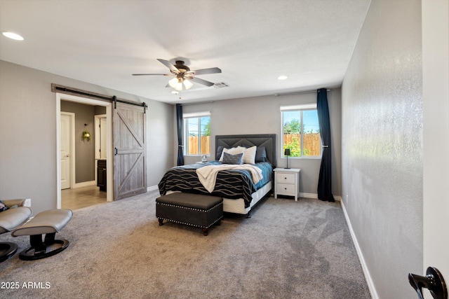 2726 E Fairmount Ave, Phoenix, AZ 85016 - bedroom with carpet floors, a barn door, baseboards, and visible vents