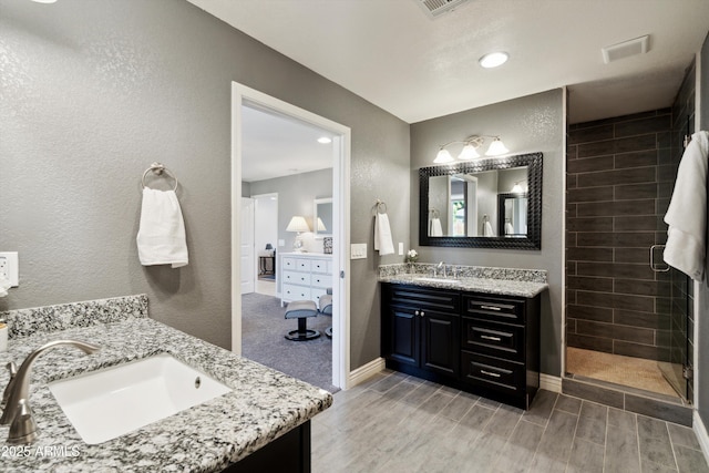 2726 E Fairmount Ave, Phoenix, AZ 85016 - full bath featuring a sink, two vanities, and wood tiled floor