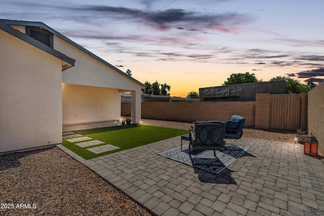 2726 E Fairmount Ave, Phoenix, AZ 85016 - patio terrace at dusk with a fenced backyard