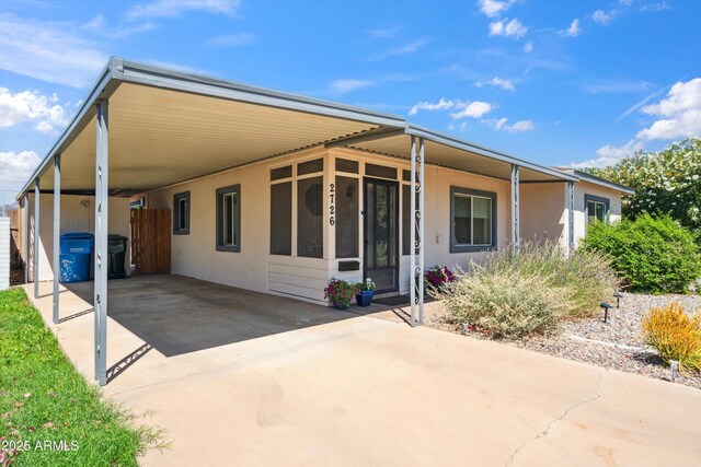 2726 E Fairmount Ave, Phoenix, AZ 85016 - back of house with concrete driveway, stucco siding, and a carport