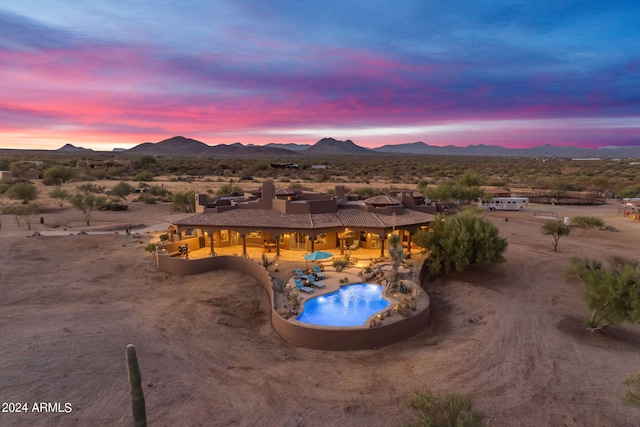 exterior space with a mountain view and a desert view