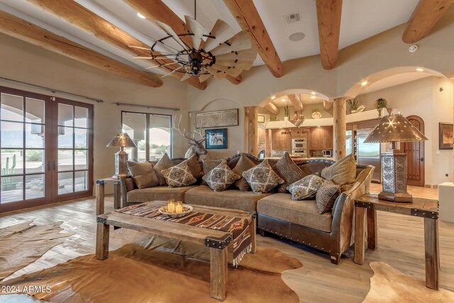 living room with french doors, beam ceiling, ceiling fan, and light hardwood / wood-style floors