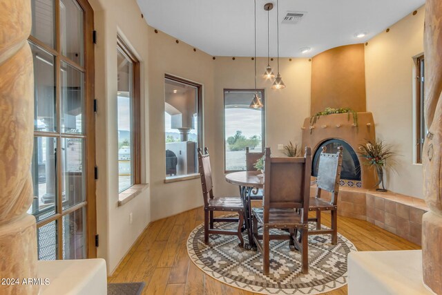 dining space with a healthy amount of sunlight and light hardwood / wood-style flooring