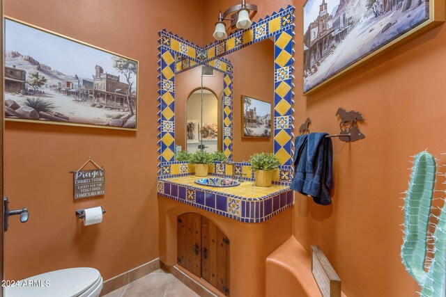 bathroom featuring toilet and tile patterned floors