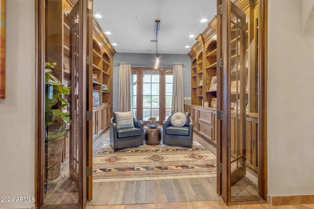 interior space featuring french doors and light hardwood / wood-style floors