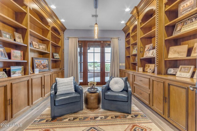 sitting room featuring light hardwood / wood-style floors