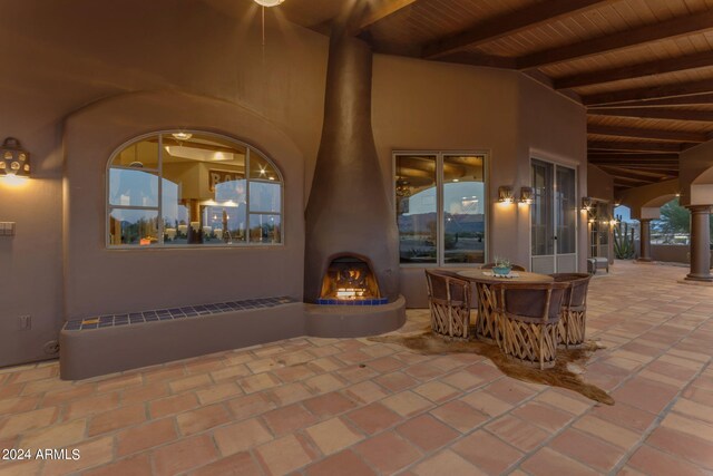 view of patio featuring a fireplace and radiator heating unit