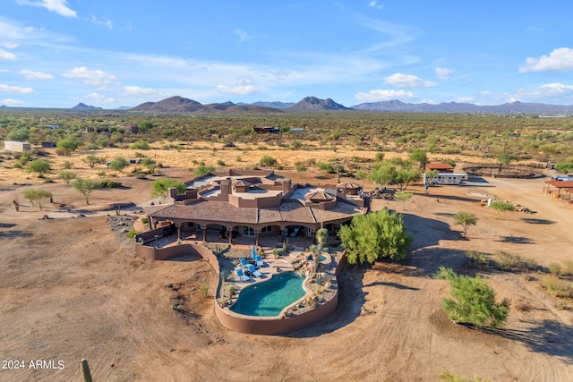 aerial view featuring view of desert and a mountain view