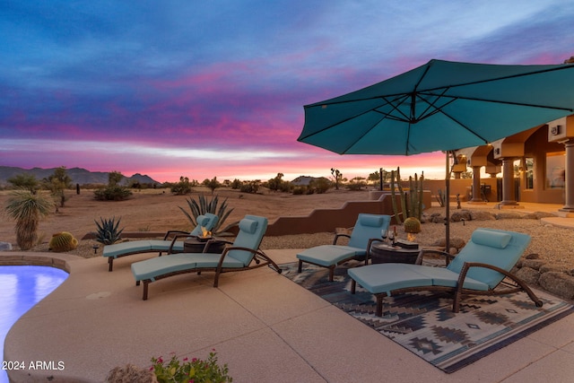 view of patio terrace at dusk