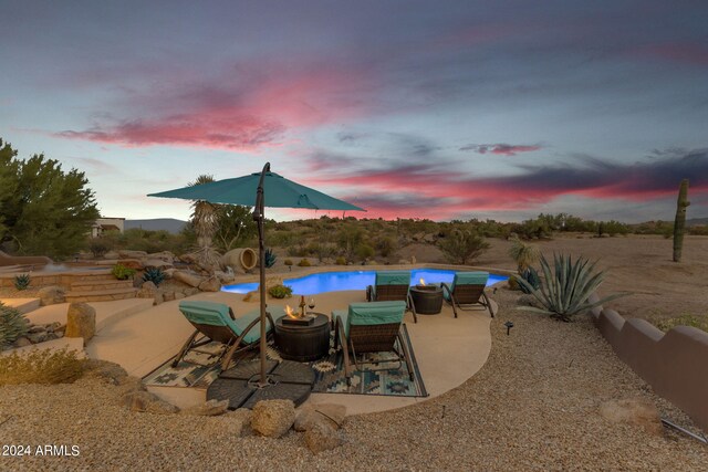 view of patio terrace at dusk