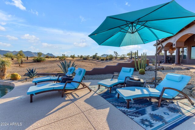 view of patio featuring a mountain view