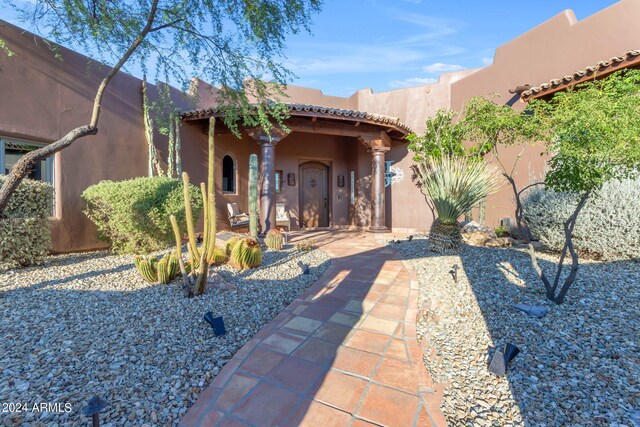 entrance to property with a patio