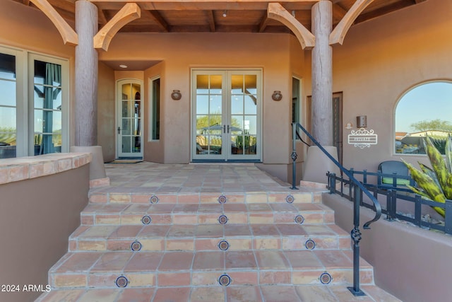 doorway to property featuring a patio area and french doors