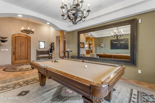 recreation room with billiards, a chandelier, and light tile patterned flooring