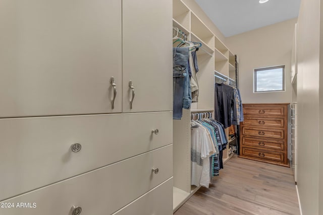 spacious closet featuring light hardwood / wood-style floors