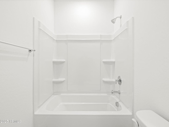 full bath featuring shower / tub combination and toilet