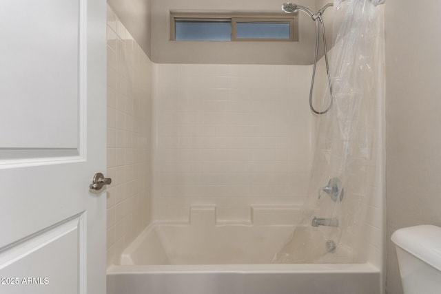 full bath with toilet and shower / bath combo with shower curtain