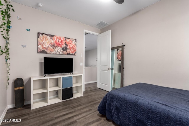 bedroom with dark wood-type flooring, visible vents, and baseboards