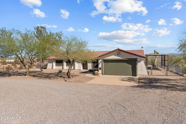 view of front facade featuring a garage and a carport