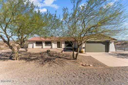 ranch-style house featuring a garage