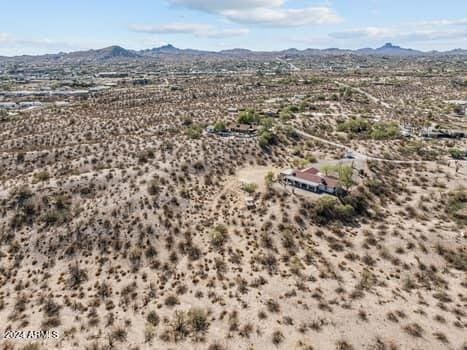 drone / aerial view featuring a mountain view