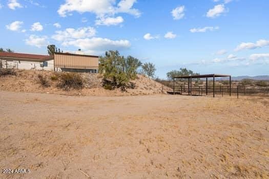 view of yard with a rural view