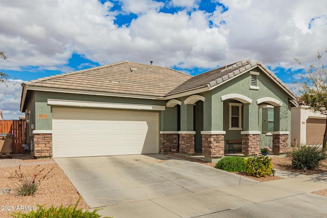 view of front of property with a porch, an attached garage, stucco siding, concrete driveway, and stone siding