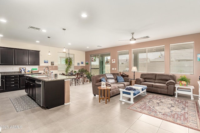 living room with light tile patterned flooring, visible vents, recessed lighting, and a ceiling fan