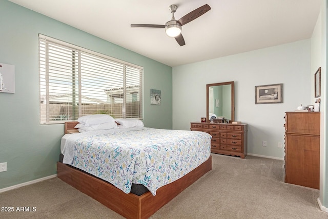 bedroom featuring carpet flooring, baseboards, and ceiling fan