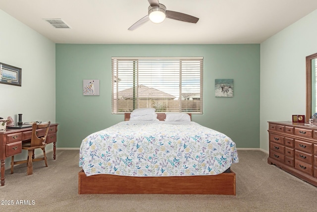 bedroom featuring light colored carpet, visible vents, and baseboards