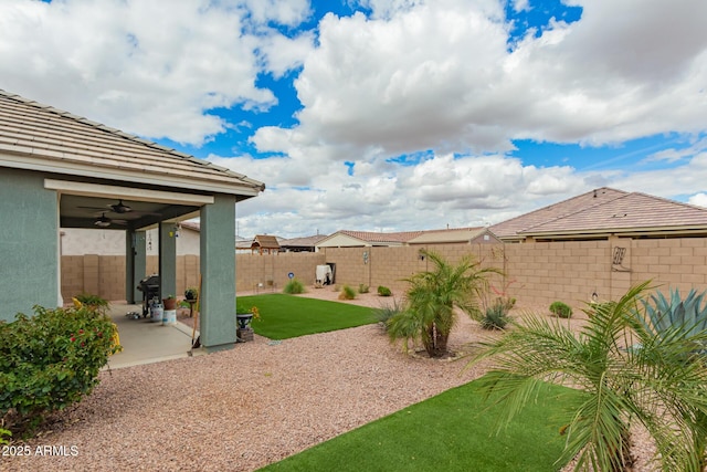 view of yard featuring a patio area and a fenced backyard