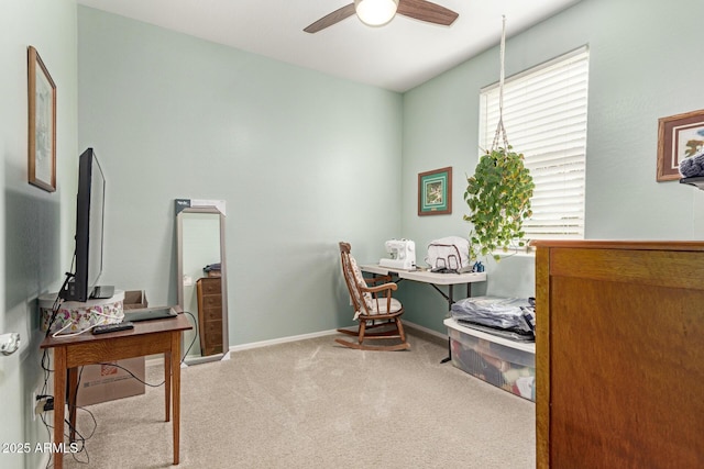 office space with carpet flooring, baseboards, and ceiling fan