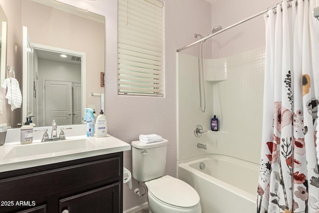 full bath with vanity, toilet, and shower / tub combo with curtain