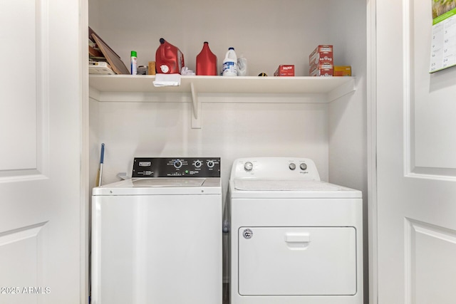 clothes washing area featuring washing machine and dryer and laundry area