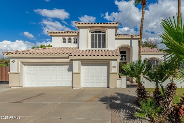 mediterranean / spanish home featuring a garage