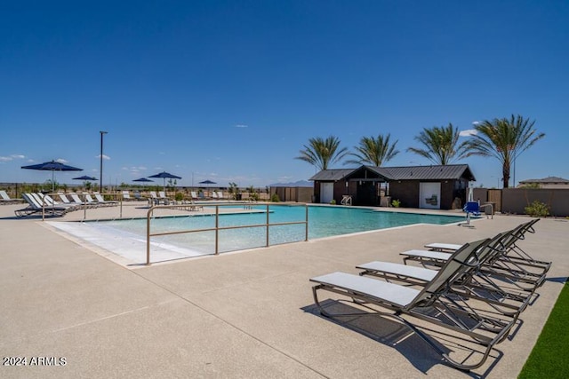 view of swimming pool featuring a patio area